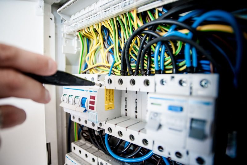 Electrician working on panel